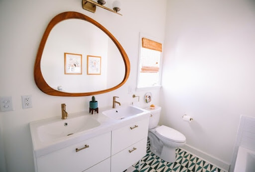 A bathroom with a large mirror and double sinks