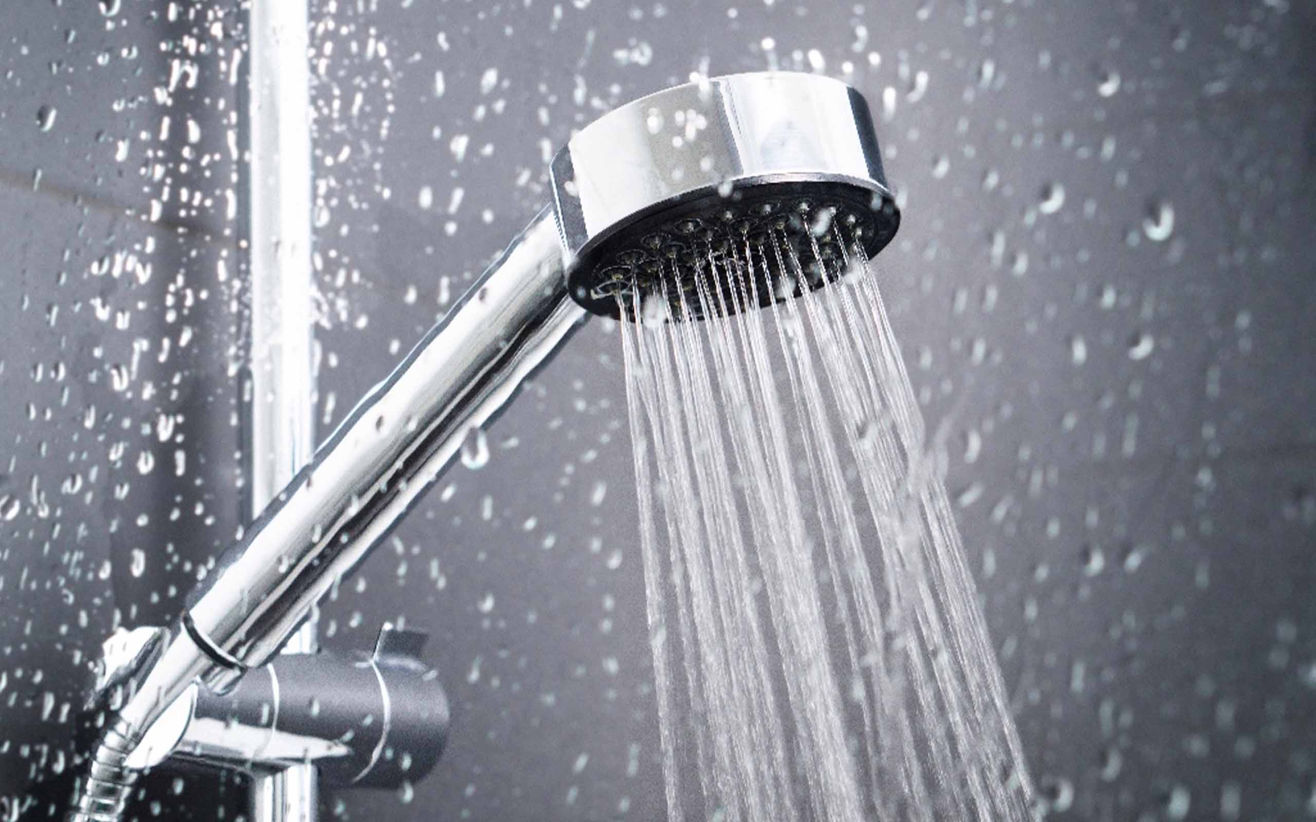 Stainless steel shower with water pouring out