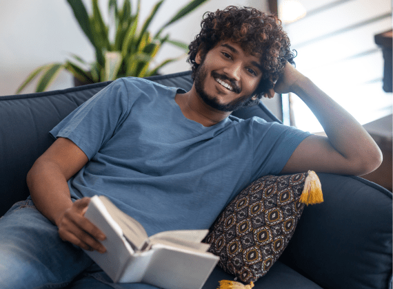 Asian-man-relaxing-with-book