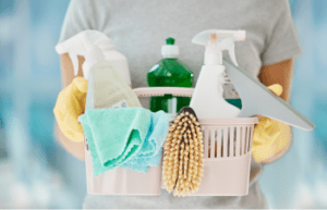 lady-holding-cleaning-products